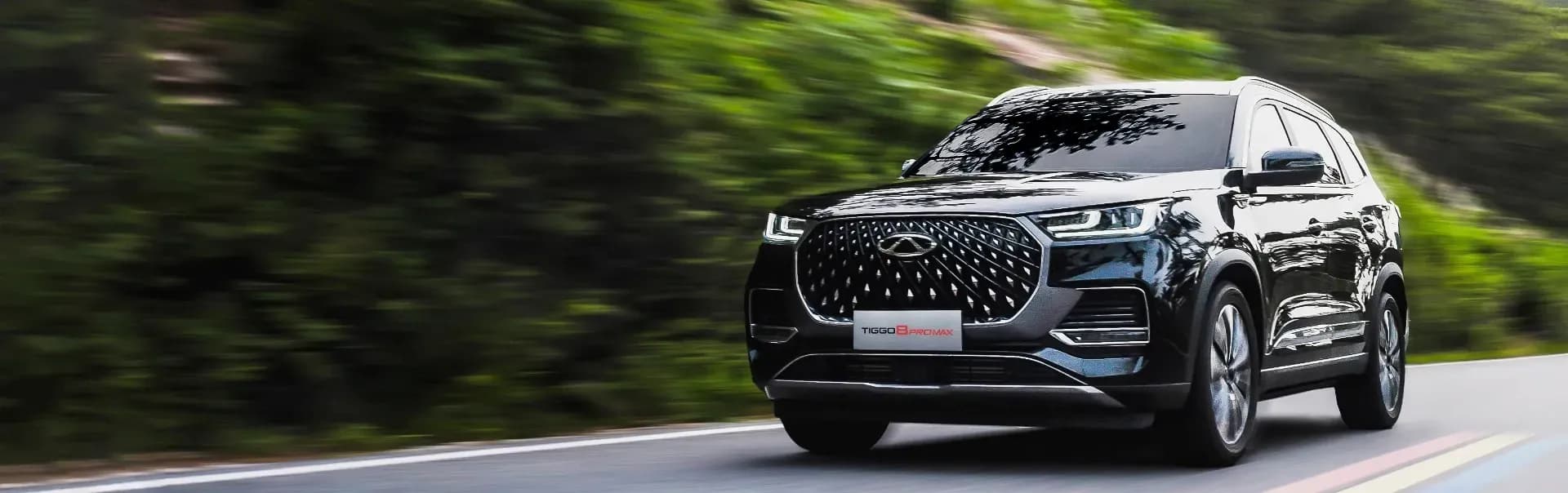 A Chery SUV on an open coastal road in Fiji